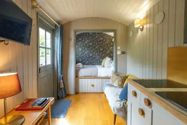 Digby's Hut at Brosterfield Farm furnished with a double bed and kitchenette