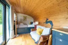 Robin's Nest glamping cabin bed and living area