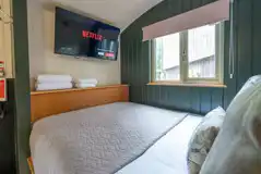 Bertie's Retreat double bed and TV