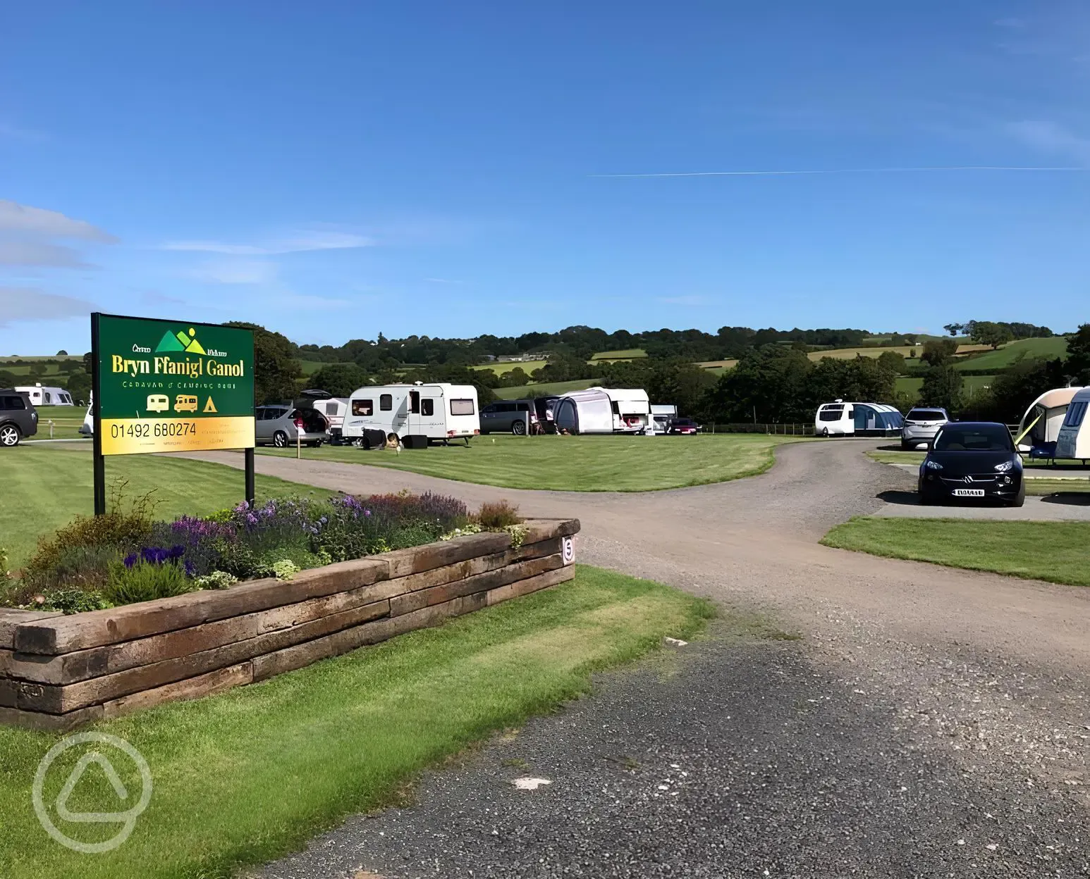 Site entrance and grass pitches