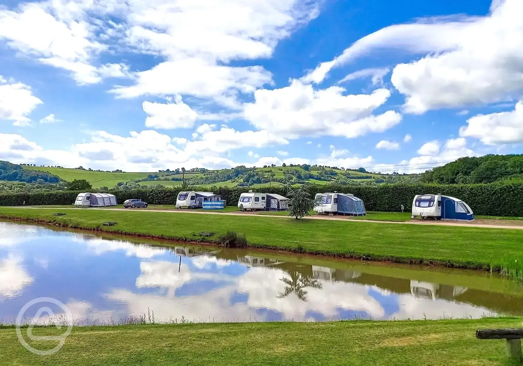 Fully serviced hardstanding touring pitches by the lake