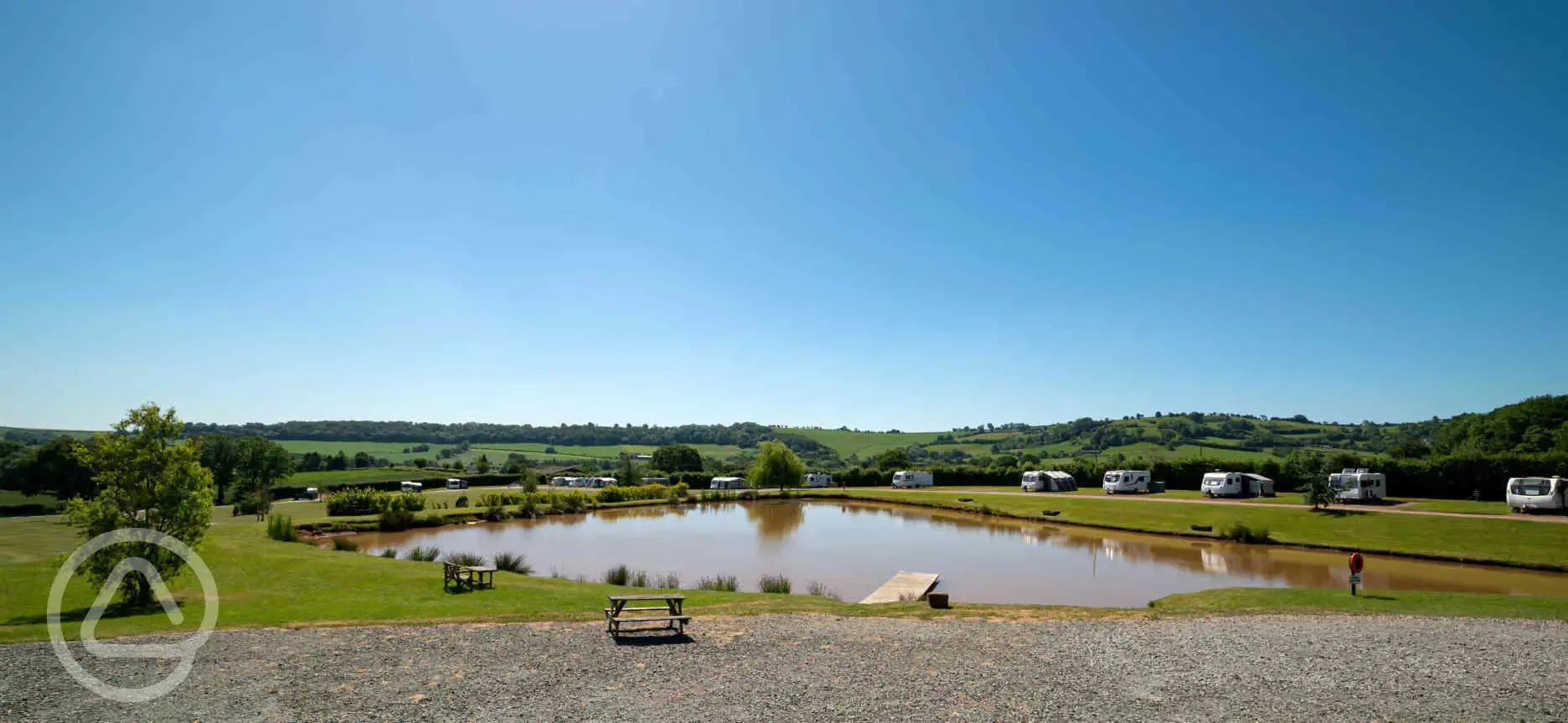 Fully serviced hardstanding touring pitches by the lake