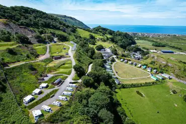 Aerial view of Bwlchgwyn Farm with far reaching coastal and countryside views