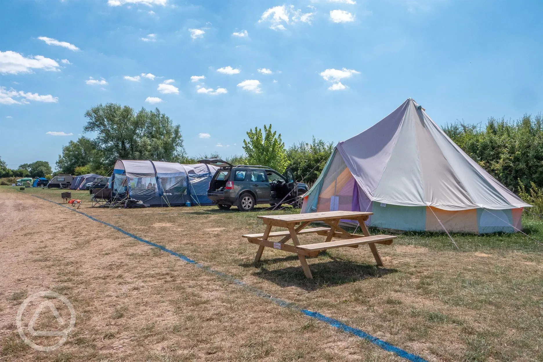 Bell tents and large tents on the electric grass pitches