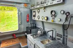 Unique yellow submarine kitchen with a hob, sink and fridge Unique yellow submarine kitchen with a hob, sink and fridge