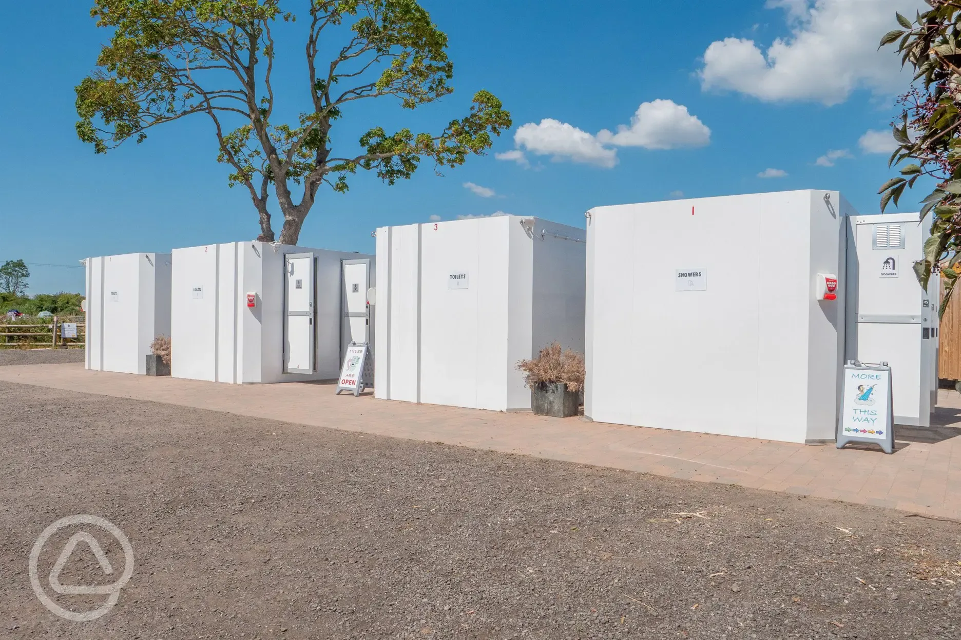 Facilitiy block with 18 showers, 28 toilets, and ten urinals