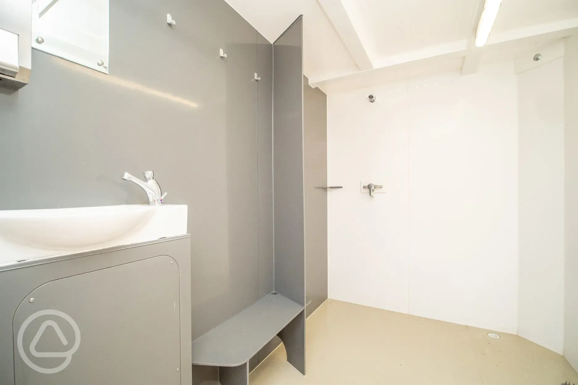 Showers (each with private changing, clothing hooks, and a soap dispenser)