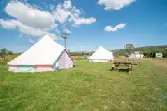 Powered bell tents with picnic bench Powered bell tents with picnic bench