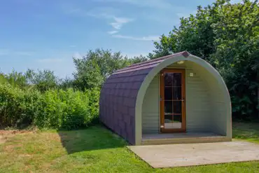 Camping pod with a small wooden deck
