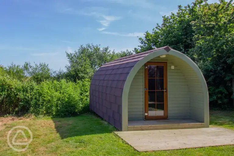 Camping pod with a small wooden deck