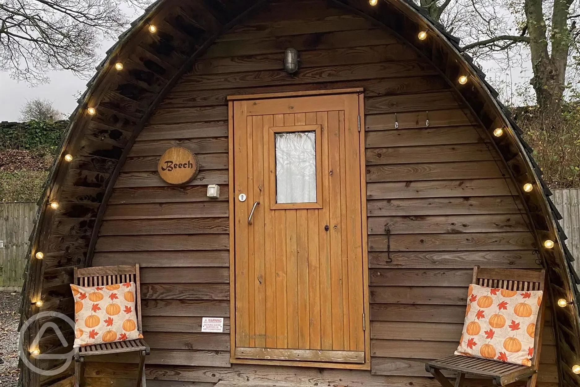 Camping pod with a small wooden porch area