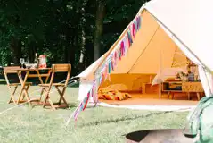 Bell tent with a private fire pit and outdoor seating area