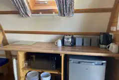 Camping pod with a fridge, microwave, kettle, toaster, cutlery and crockery
