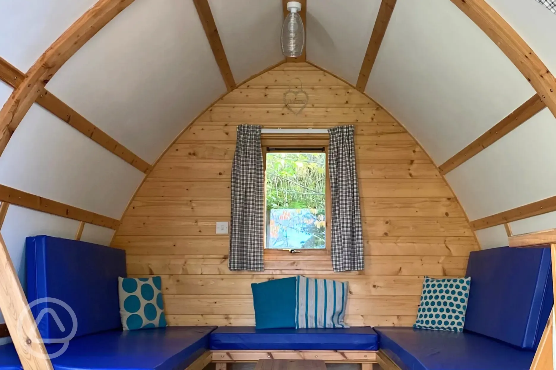 Camping pod interior with sofas