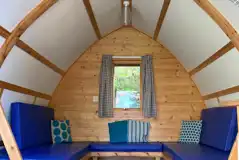 Camping pod interior with sofas
