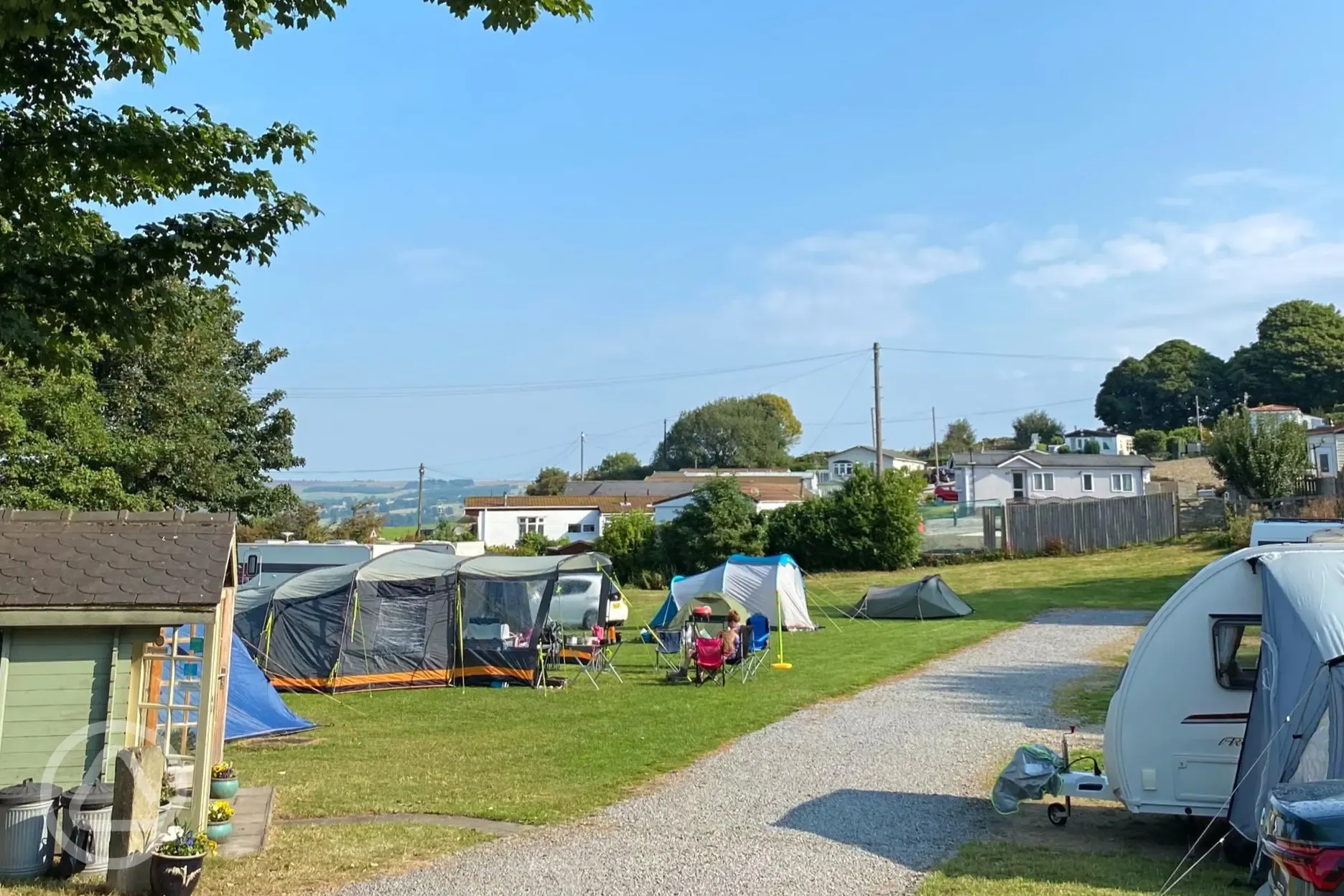 Grass pitches with a stone driving path between