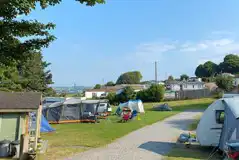 Grass pitches with a stone driving path between