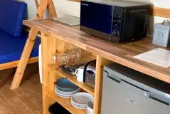 Camping pod with a fridge, microwave, kettle, toaster, cutlery and crockery