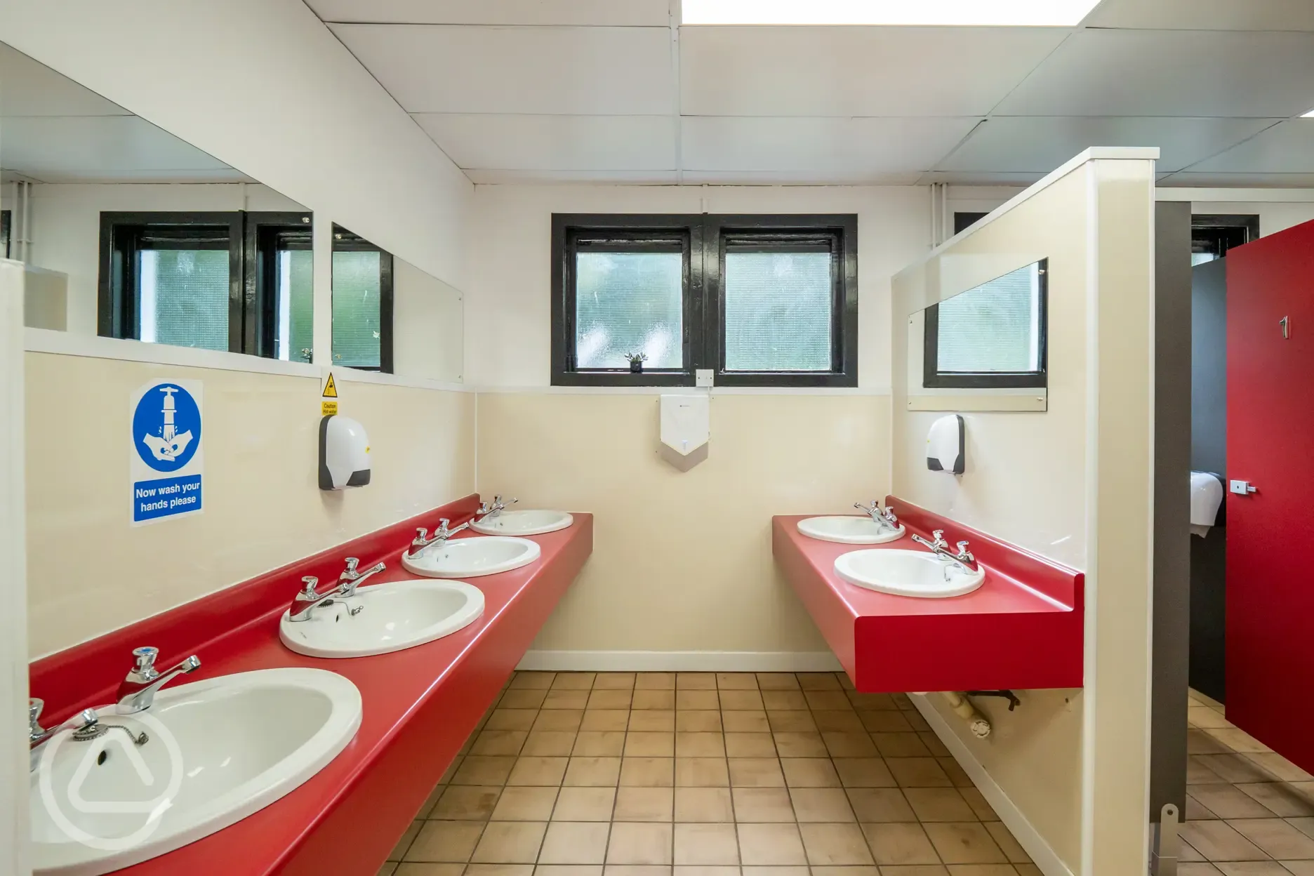 Site toilets and showers with sinks and mirrors
