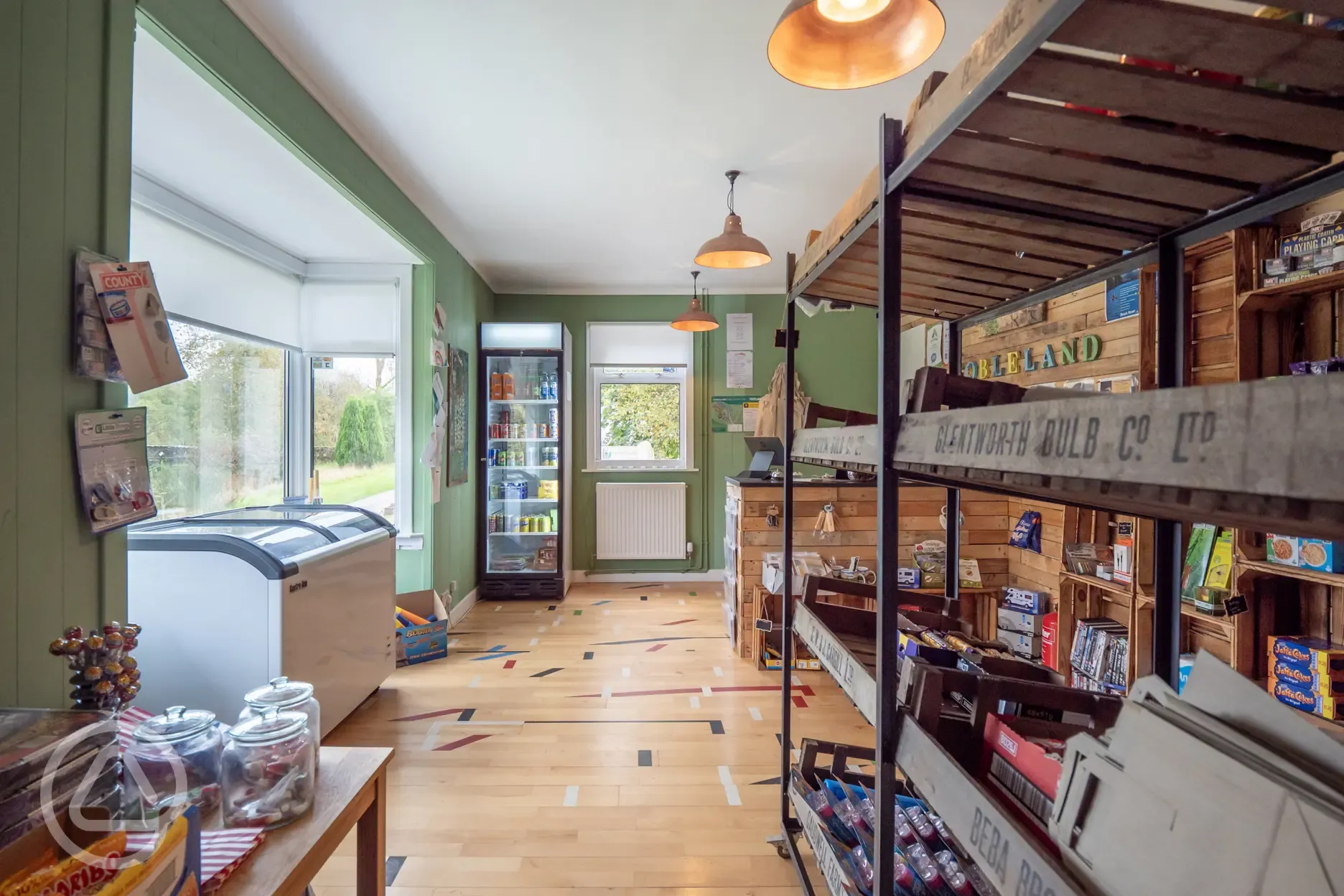 Site shop stocking ice cream and camping equipment