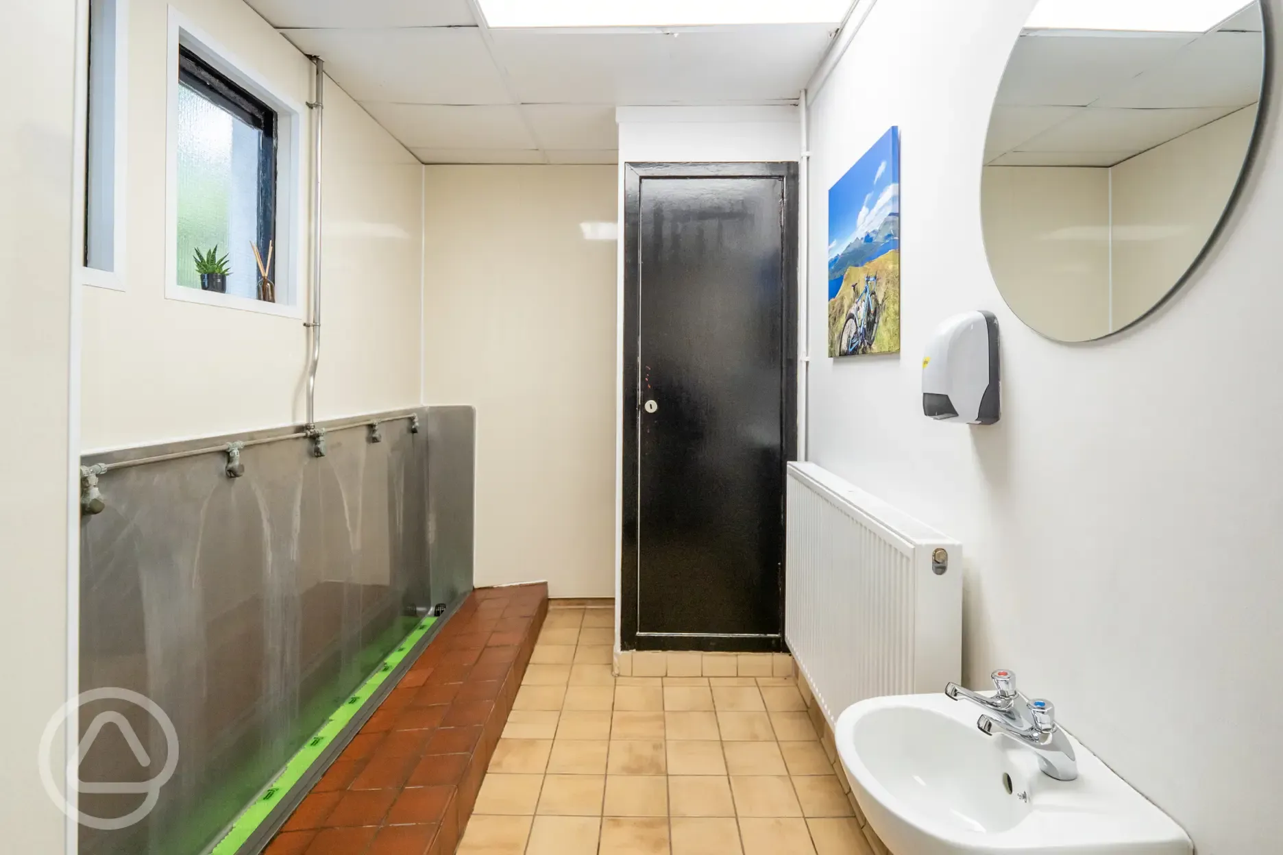 Men's toilets with sink and mirror