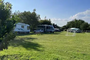 Electric grass touring pitches and football goals at Crane Cross Camping Park