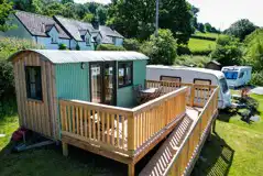 Shepherds hut's next to grass pitches