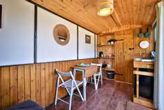 Shepherd's hut dining and kitchen area Shepherd's hut dining and kitchen area
