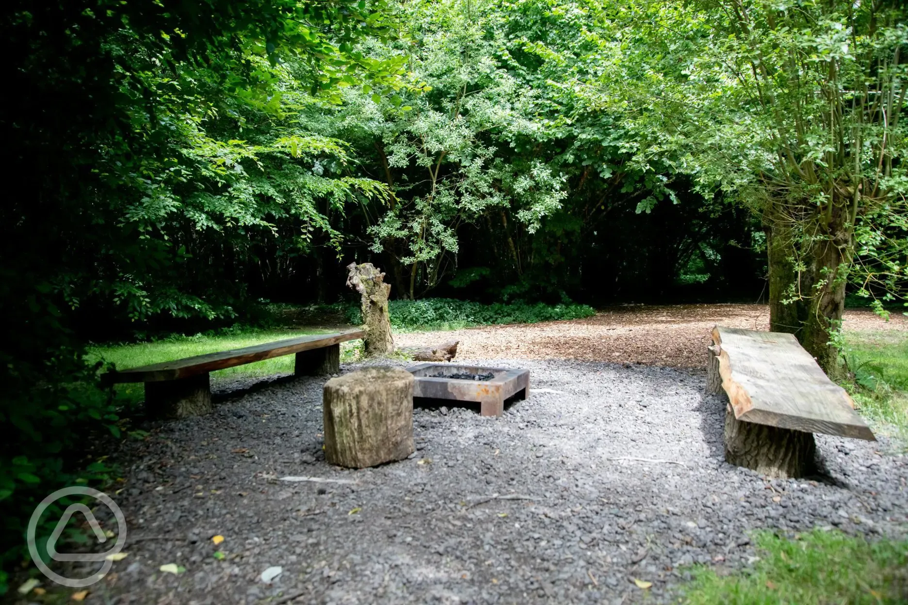 Woodland fire pit at The Encampment (woodland pitches)