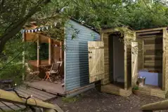 Wooden cabin outdoor sheltered kitchen and private eco loo and shower