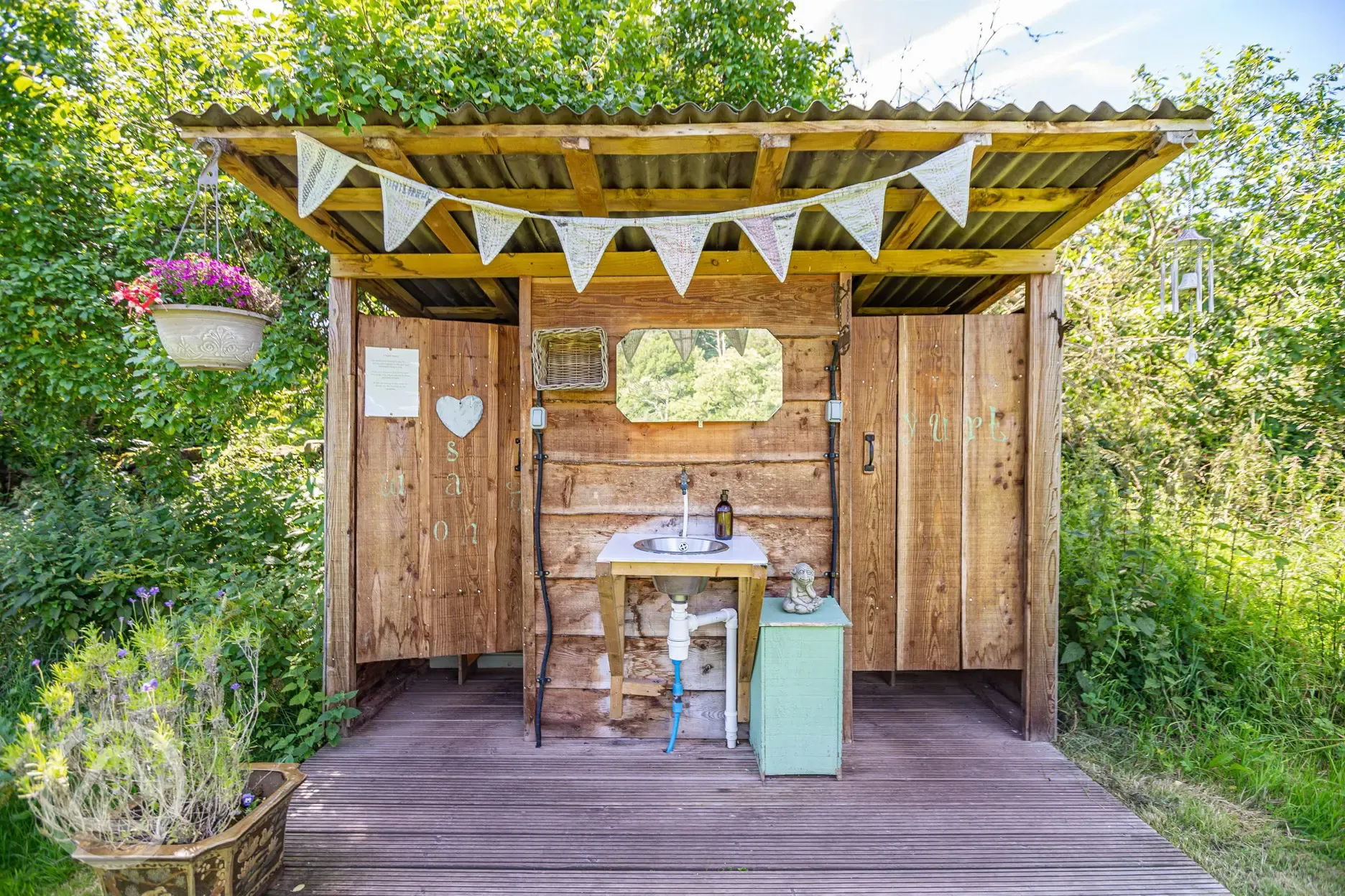 Camping facilities with eco toilets and a sheltered outdoor hand basin