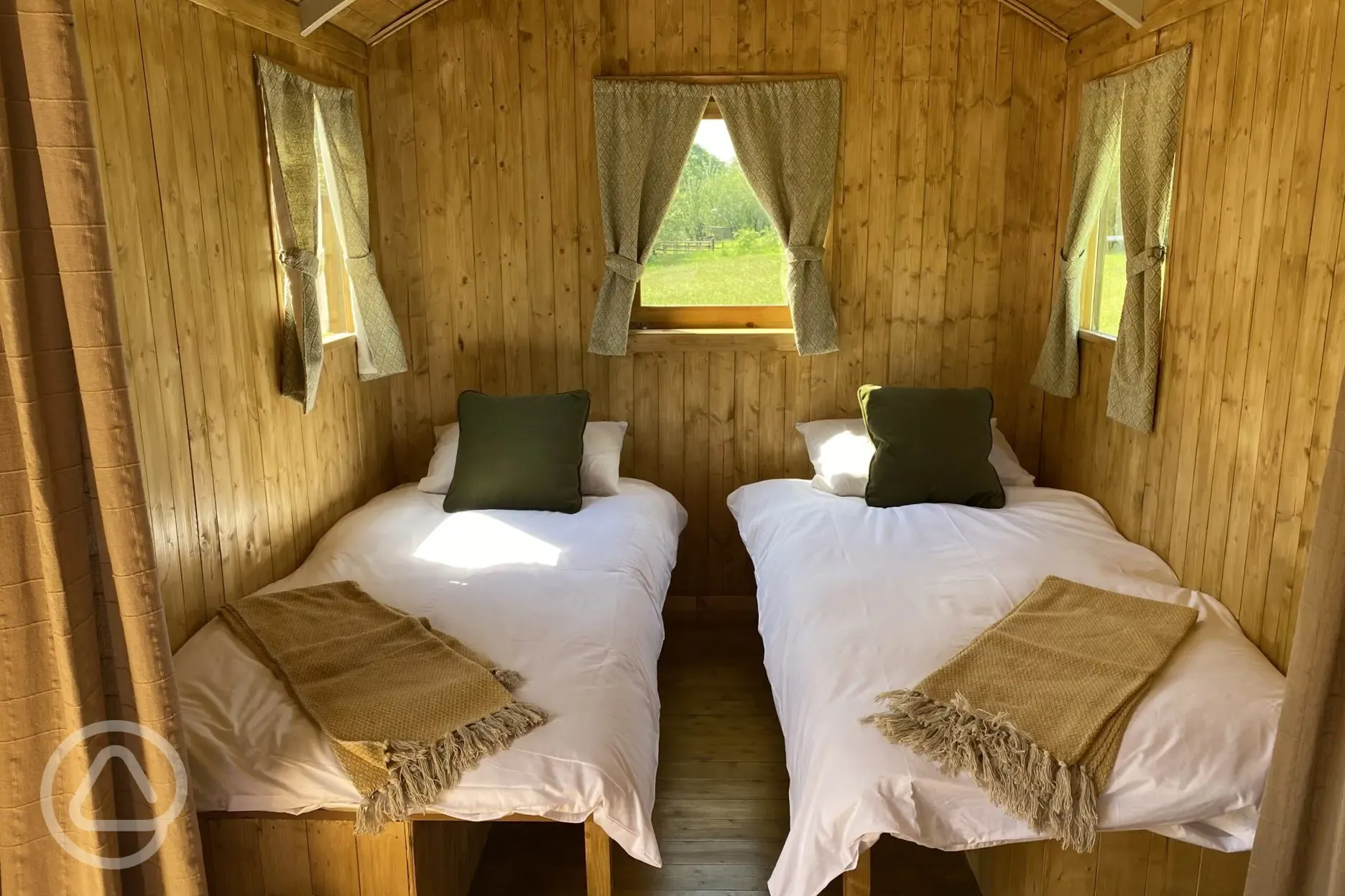 The Swaledale shepherd's hut interior with two small single beds