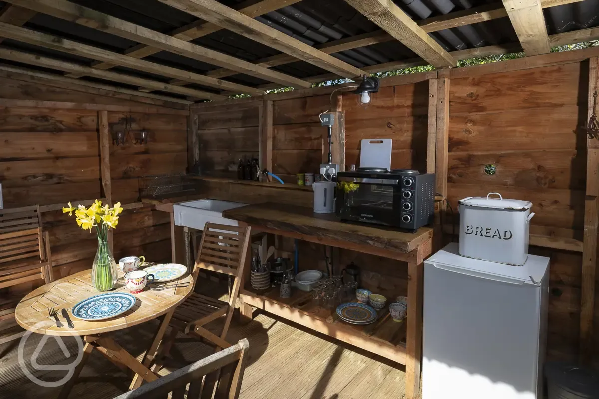 Croglin yurt with a sheltered outdoor kitchen area
