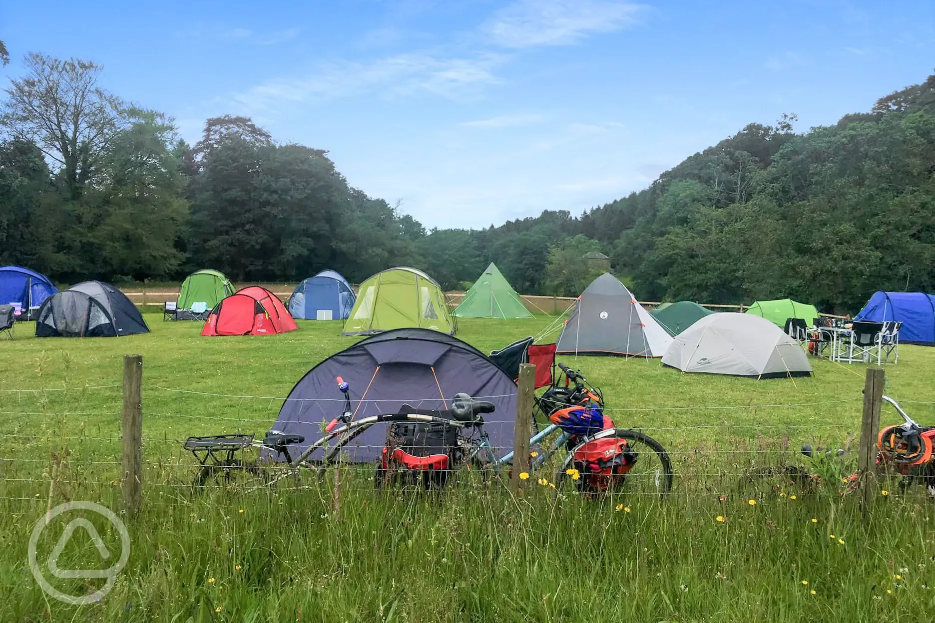 Non electric grass pitches with tent campers pitched