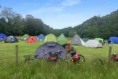Non electric grass pitches with tent campers pitched Non electric grass pitches with tent campers pitched