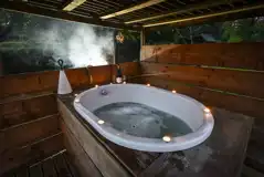Gypsy caravan Japanese-style hot tub with a wooden shelter
