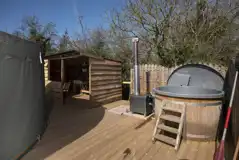 Croglin yurt outdoor deck and private wood-fired hot tub
