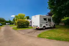 Electric hardstanding pitches with hedges for privacy