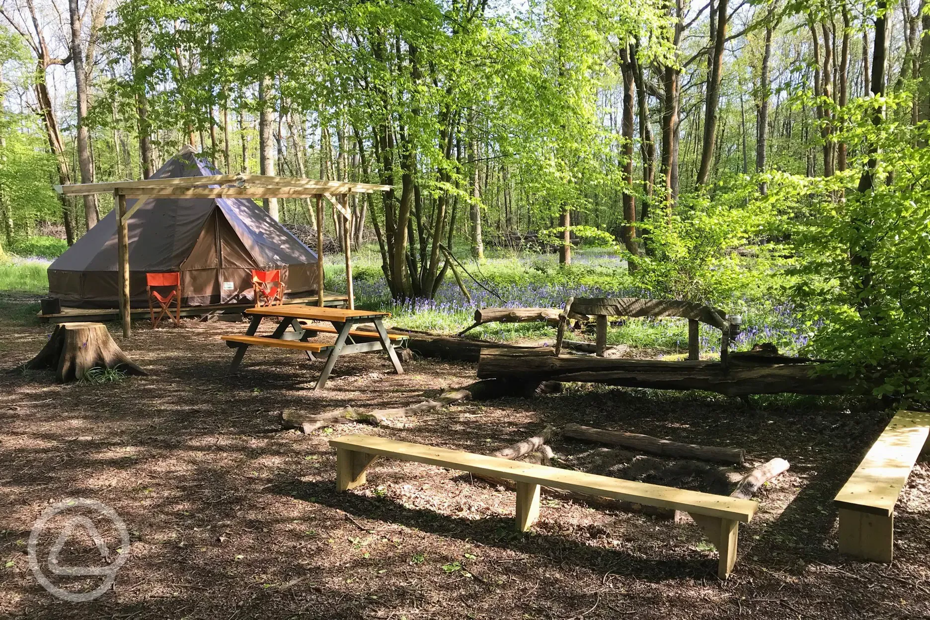 Wild glamping bell tent and outdoor seating area