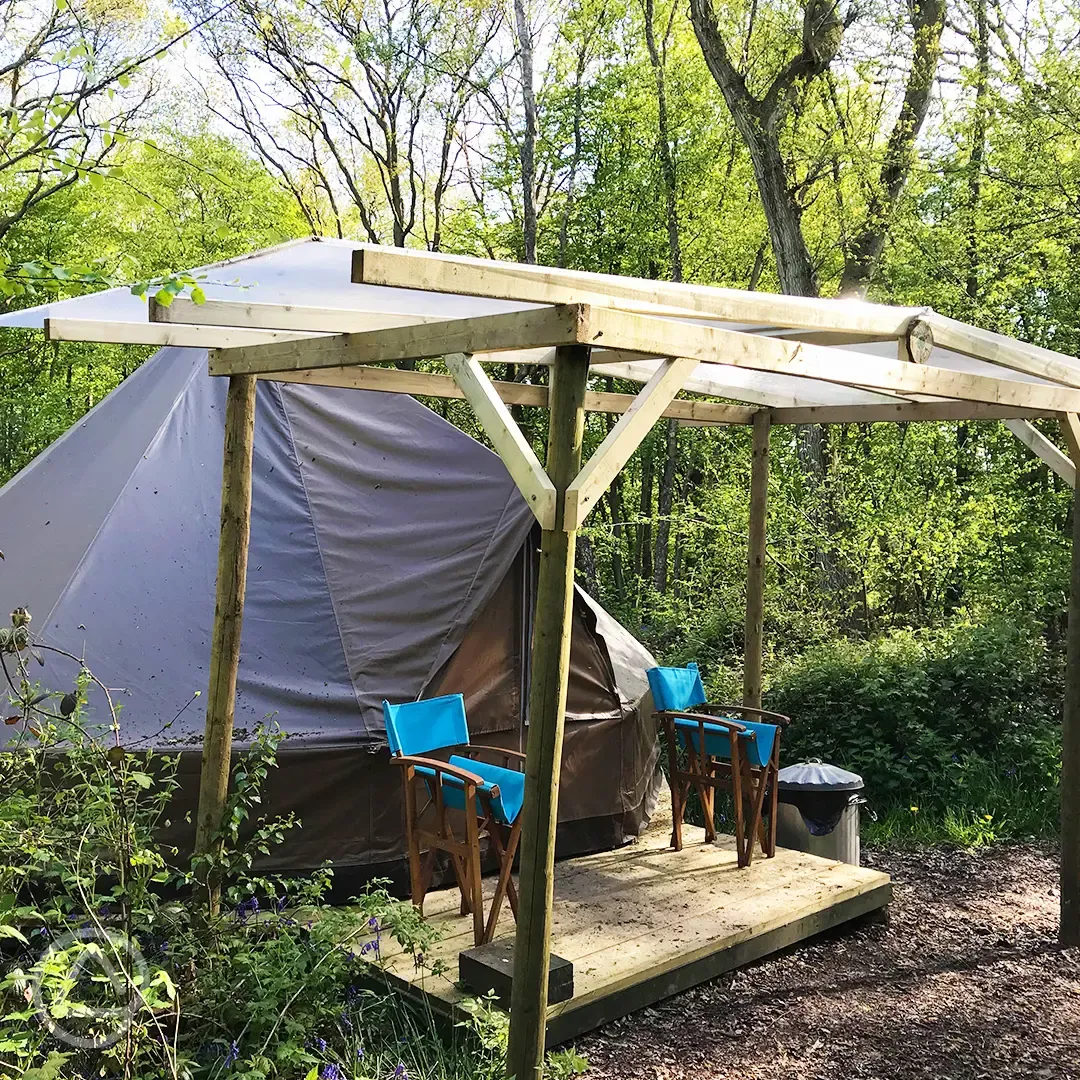 Wild glamping bell tent with covered decking area