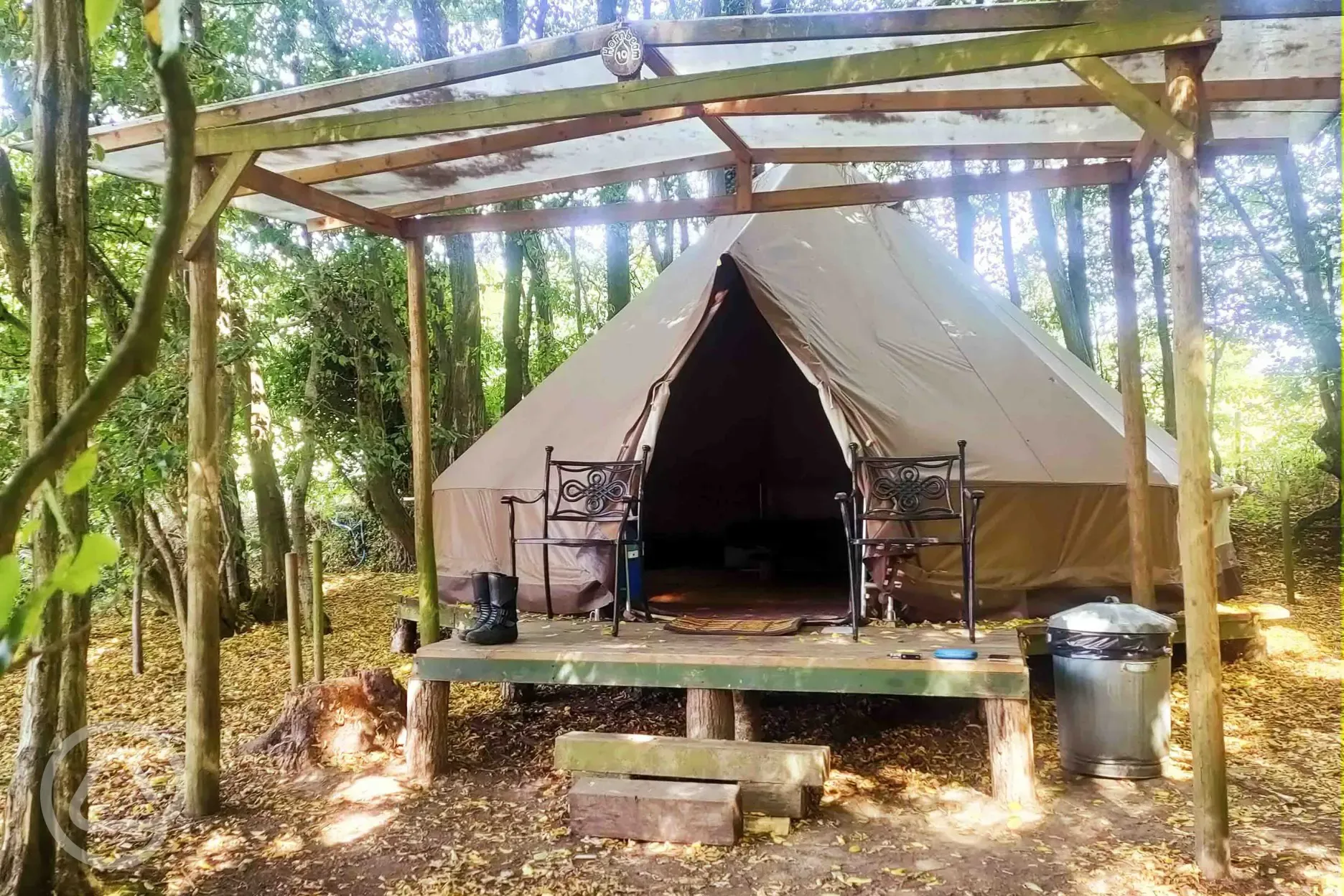 Wild glamping bell tent with covered decking area