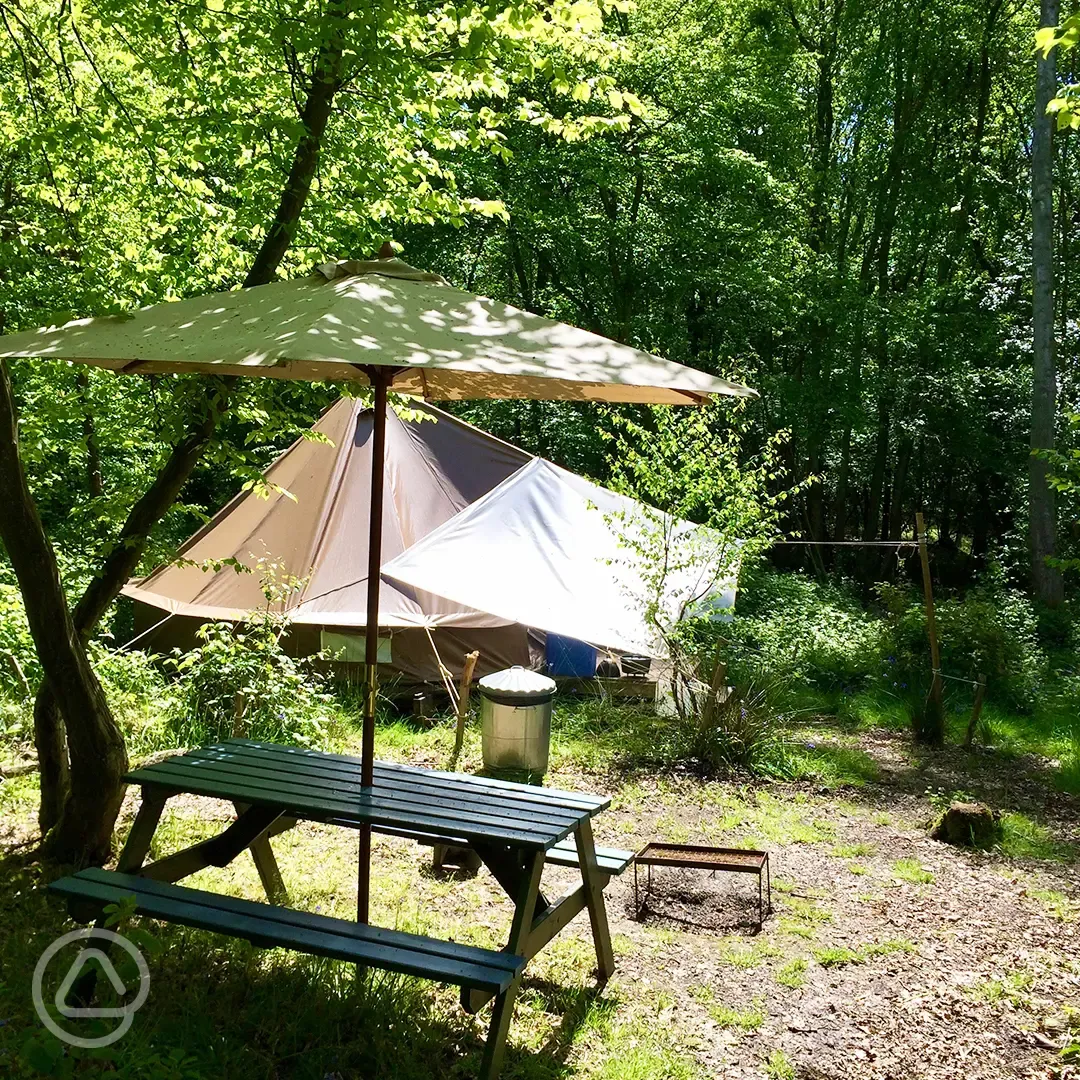 Wild glamping bell tent and outdoor seating area