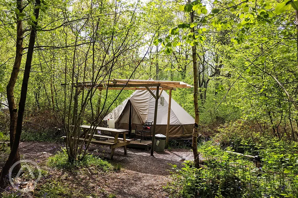 Wild glamping bell tent with covered decking area