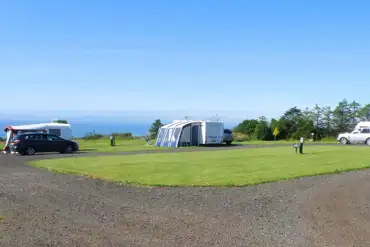 Fully serviced hardstanding pitches with sea views towards Lower Largo Beach