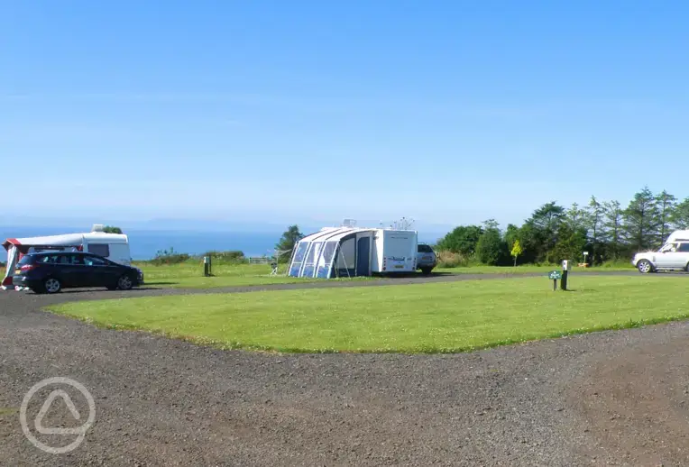 Fully serviced hardstanding pitches with sea views towards Lower Largo Beach