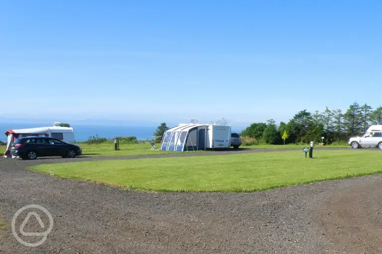 Fully serviced hardstanding pitches with sea views towards Lower Largo Beach
