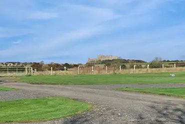 Electric hardstanding pitches with views of Bamburg Castle