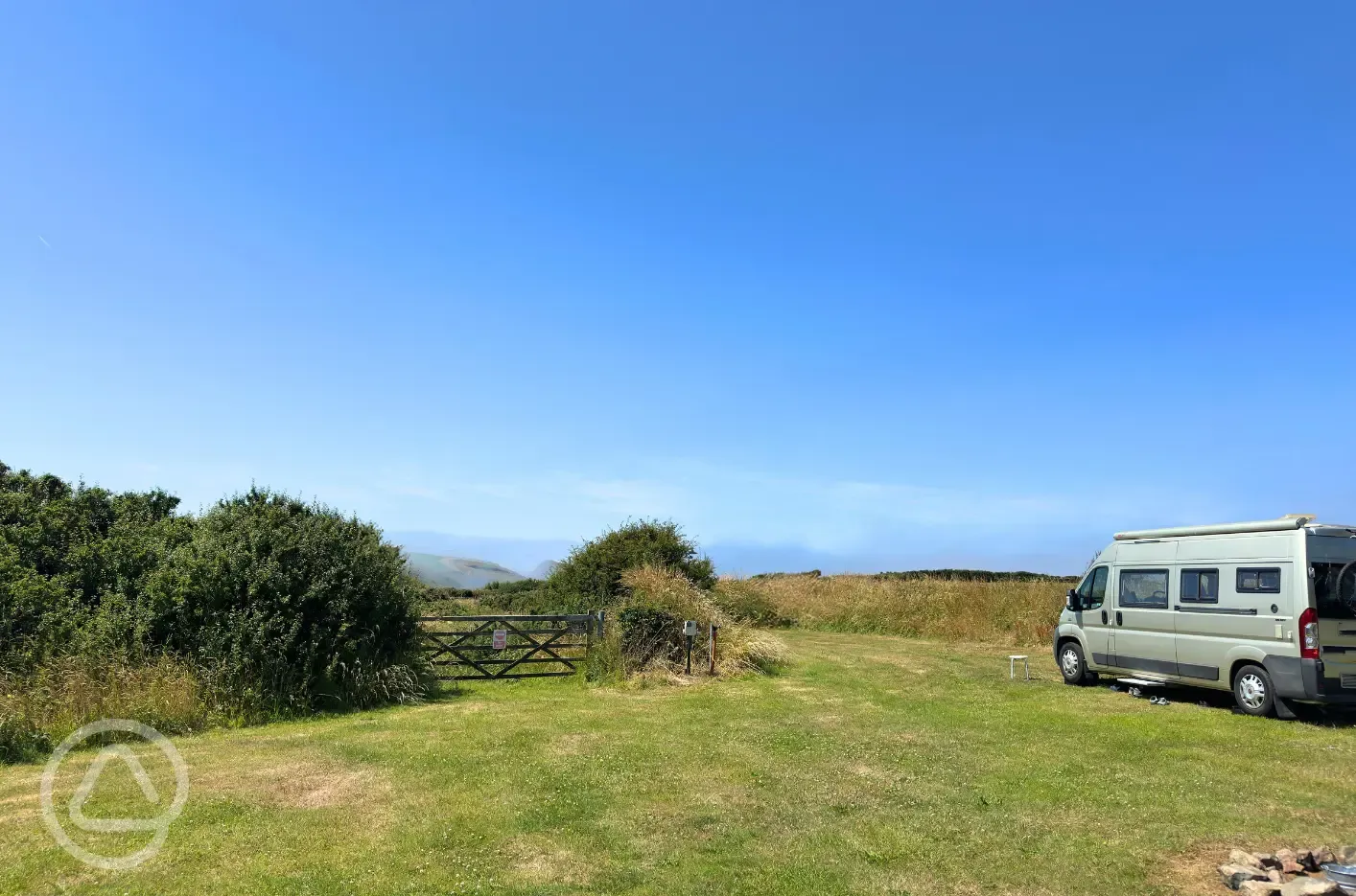Grass pitches with optional electric, picnic benches and fire pits
