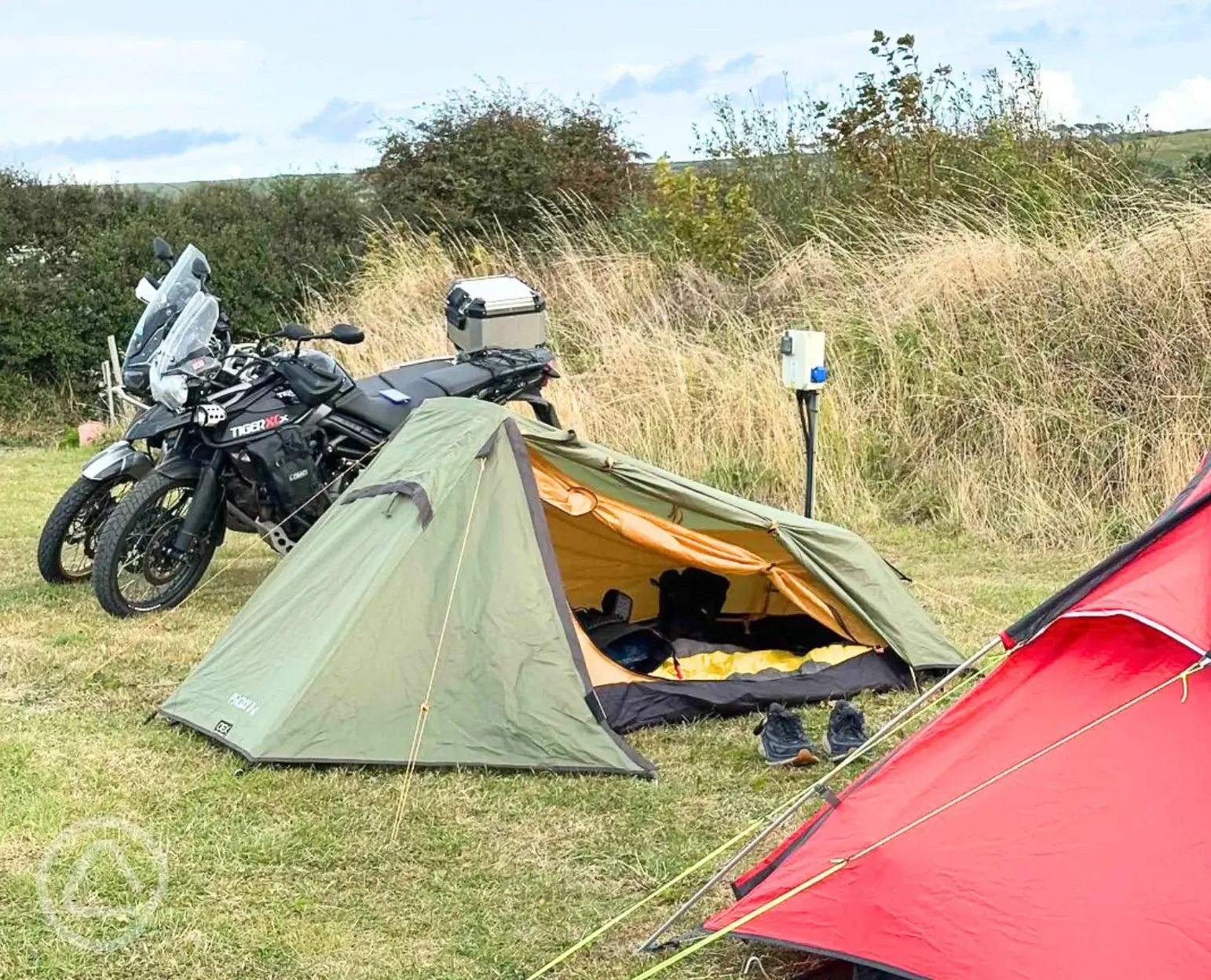 Campervan on grass pitches with optional electric, picnic benches and fire pits