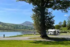 Electric hardstanding pitches with with views of Bala Lake (Llyn Tegid) 